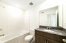 single sink vanity, water closet, and shower