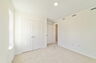 room with carpet throughout, single window and access to the closet