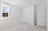 room with carpet throughout and multiple windows 