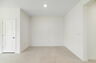 room with access to kitchen and view of great room