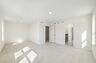 room with sitting area, carpet throughout and access to the primary bathroom