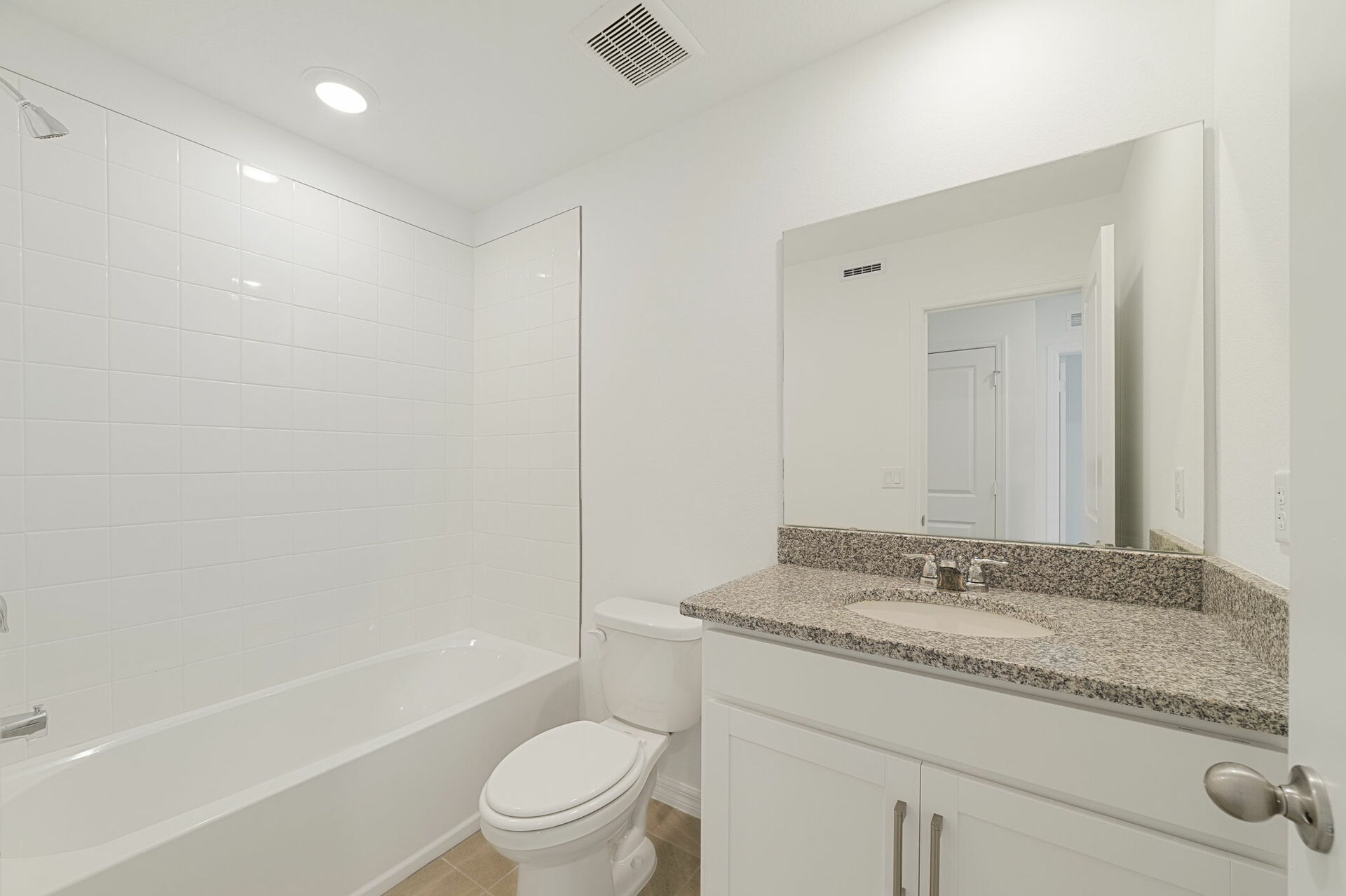single sink vanity, water closet and tub