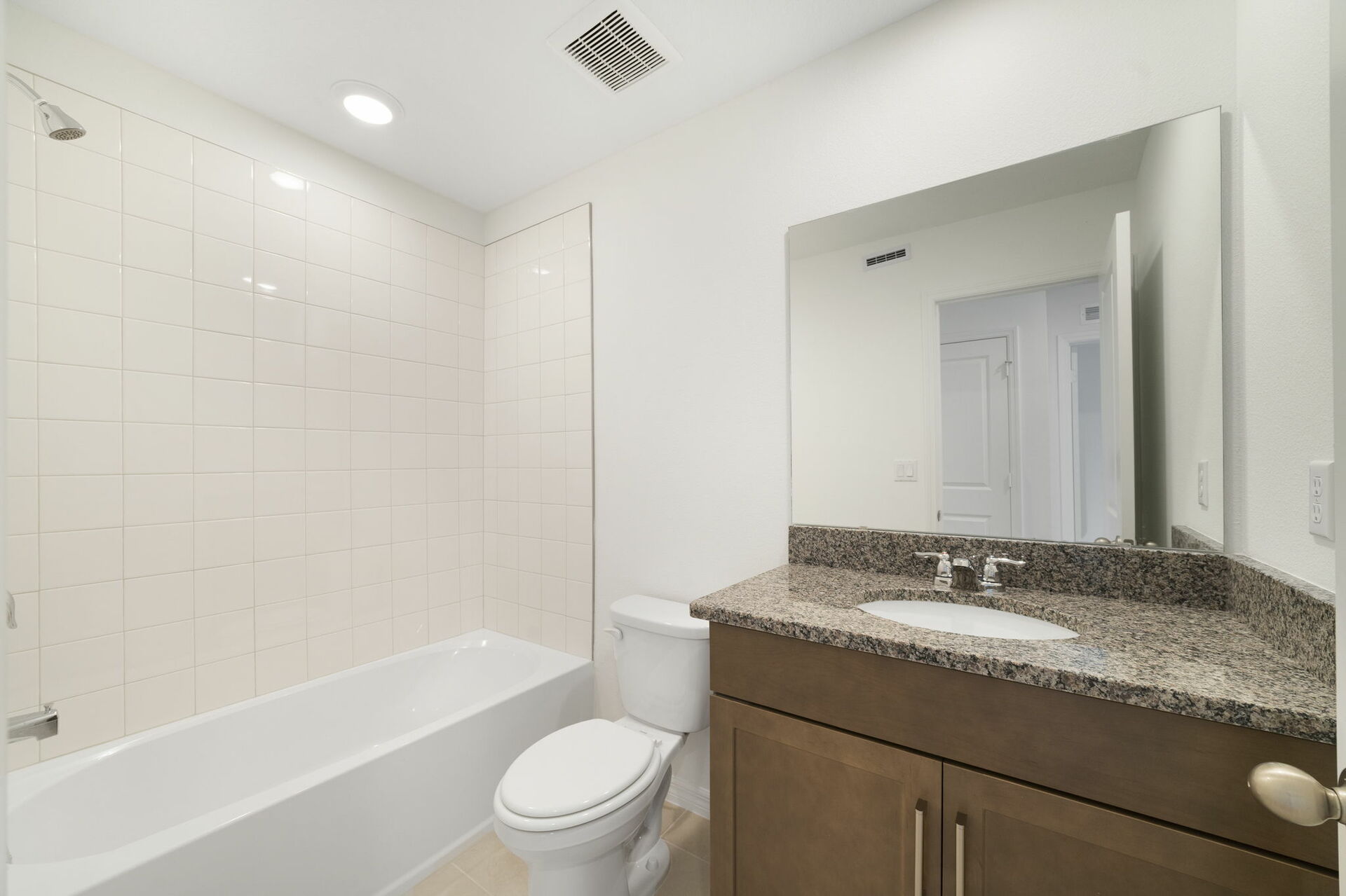 single sink vanity, water closet and tub