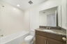 single sink vanity, water closet and tub