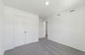 carpet throughout with a single window and closet