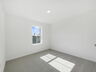 second bedroom with carpet and one window