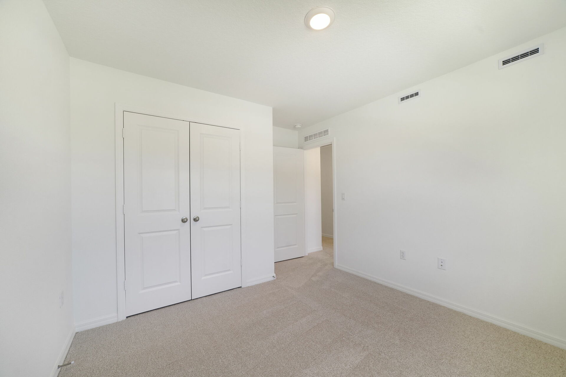 room with carpet throughout and single window