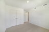 room with carpet throughout and single window