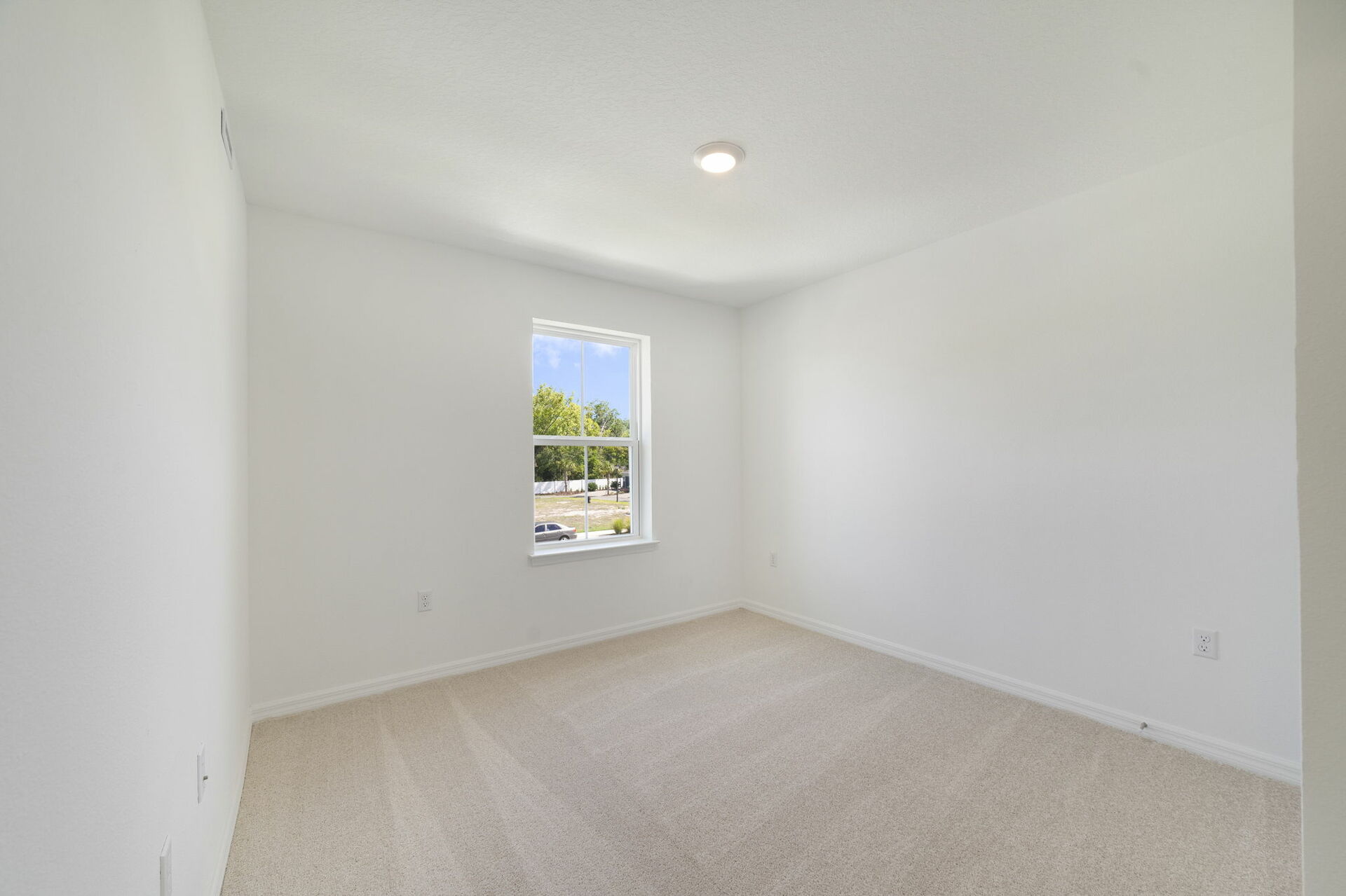 room with carpet throughout and single window