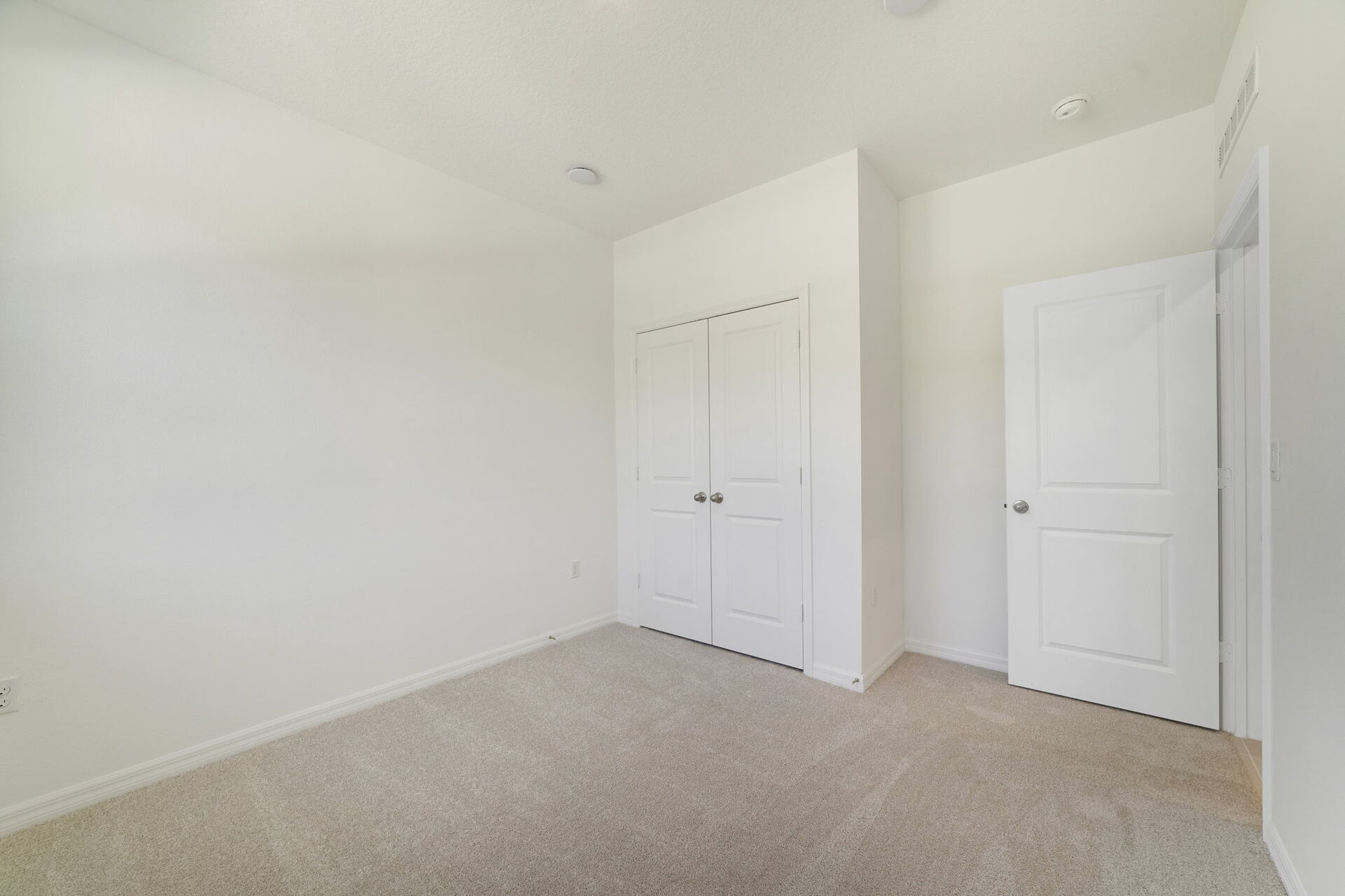 room with carpet throughout and dual window