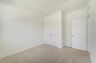 room with carpet throughout and dual window
