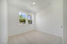 room with carpet throughout and dual window