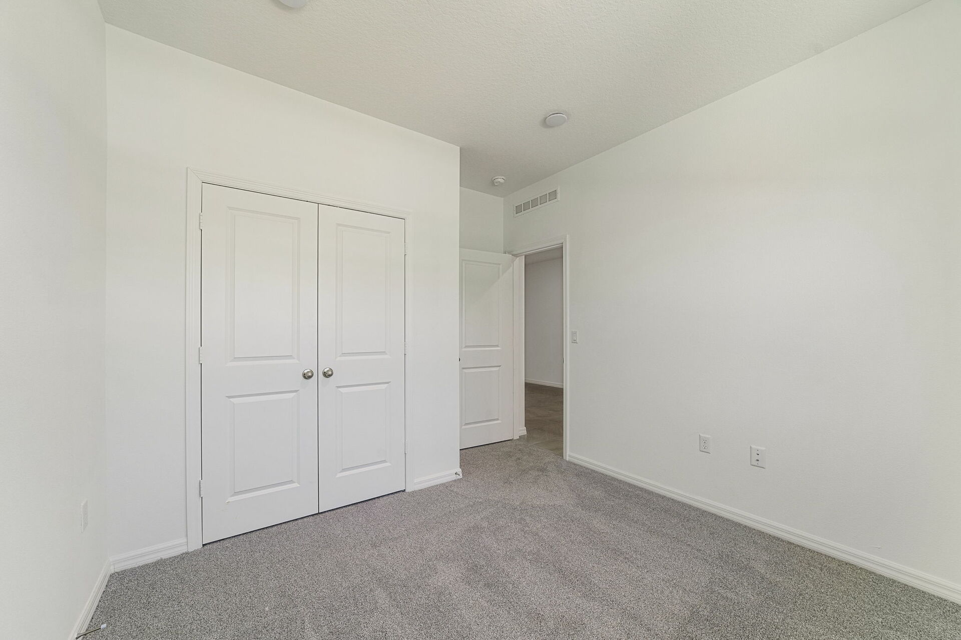 carpet throughout with single window and closet