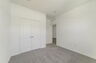 carpet throughout with single window and closet