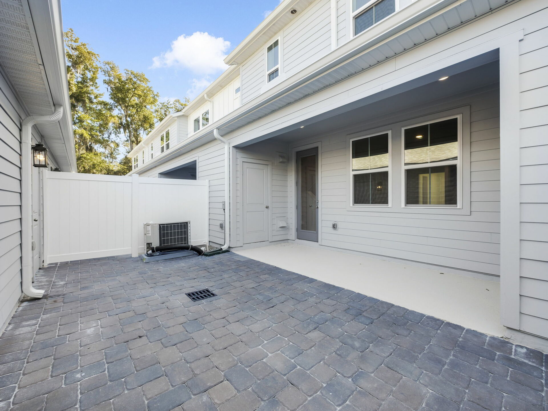 covered lanai and paver courtyard