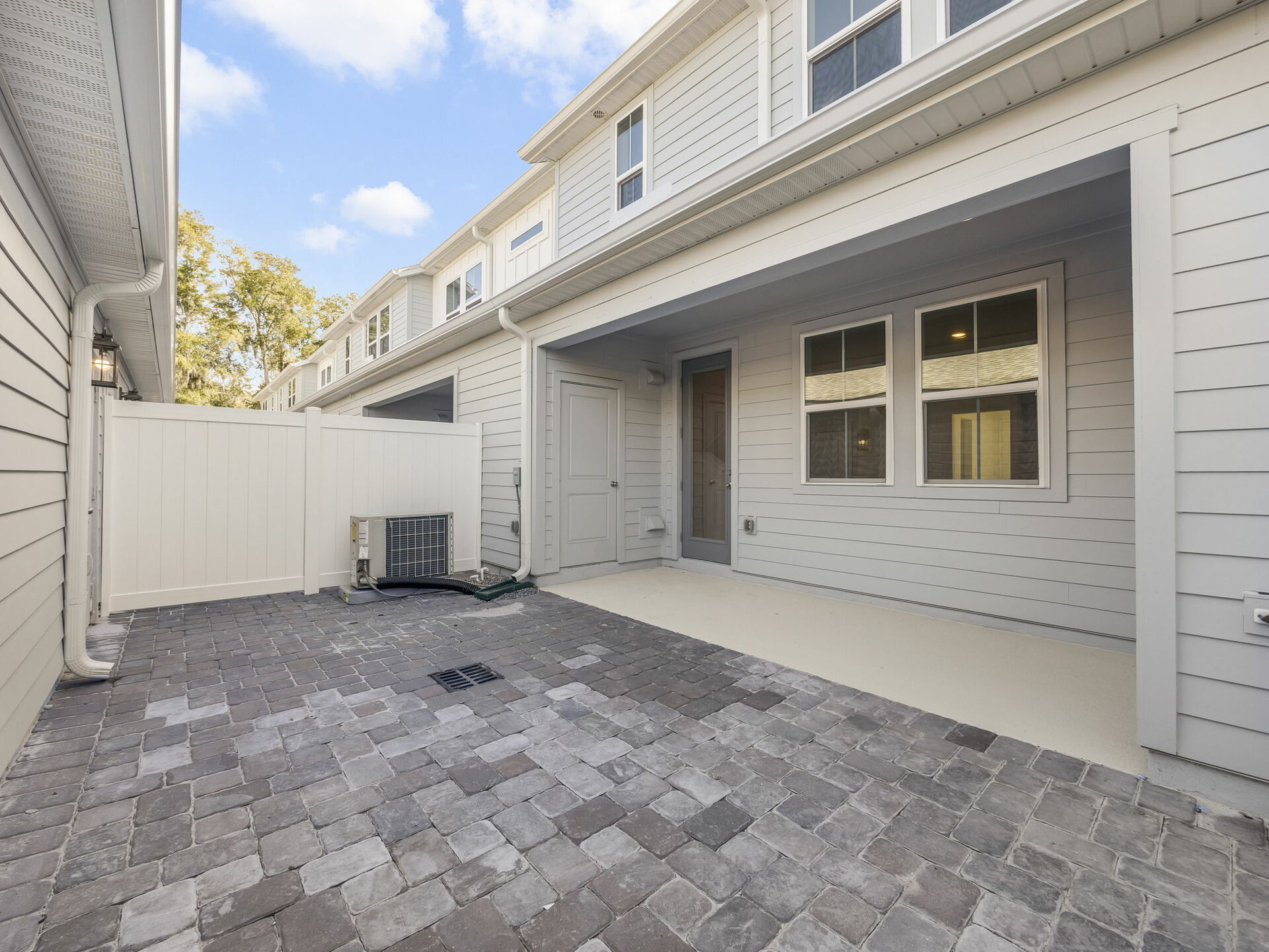 covered lanai and paver courtyard