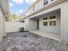 covered lanai and paver courtyard