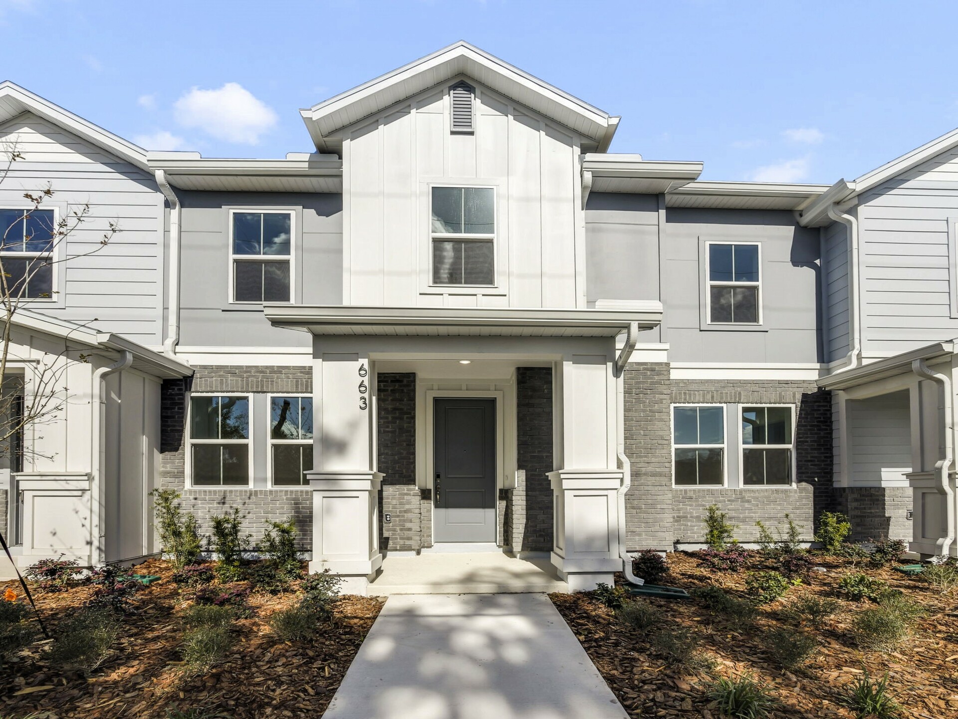 front exterior of home with porch and gray front door