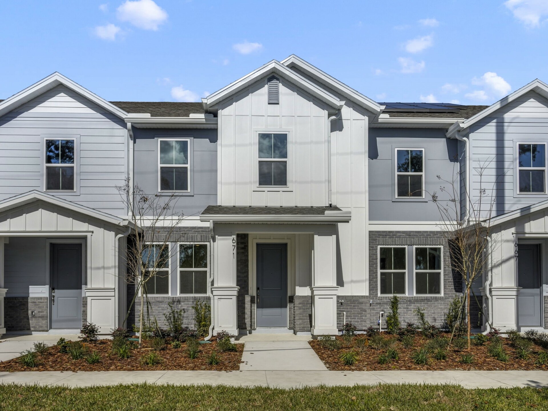 front exterior of home with porch and gray front door
