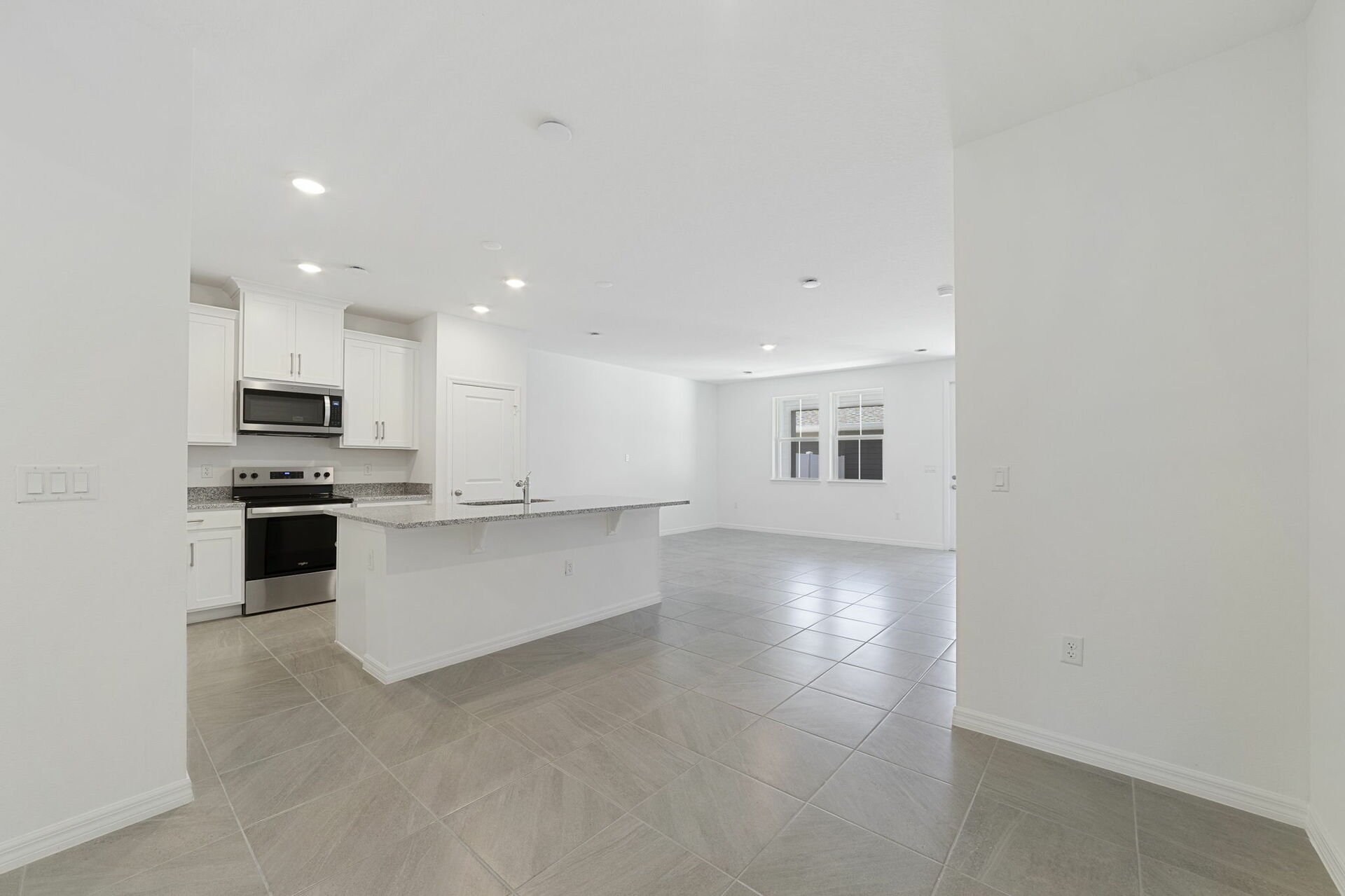 center island kitchen and stainless-steel appliances 