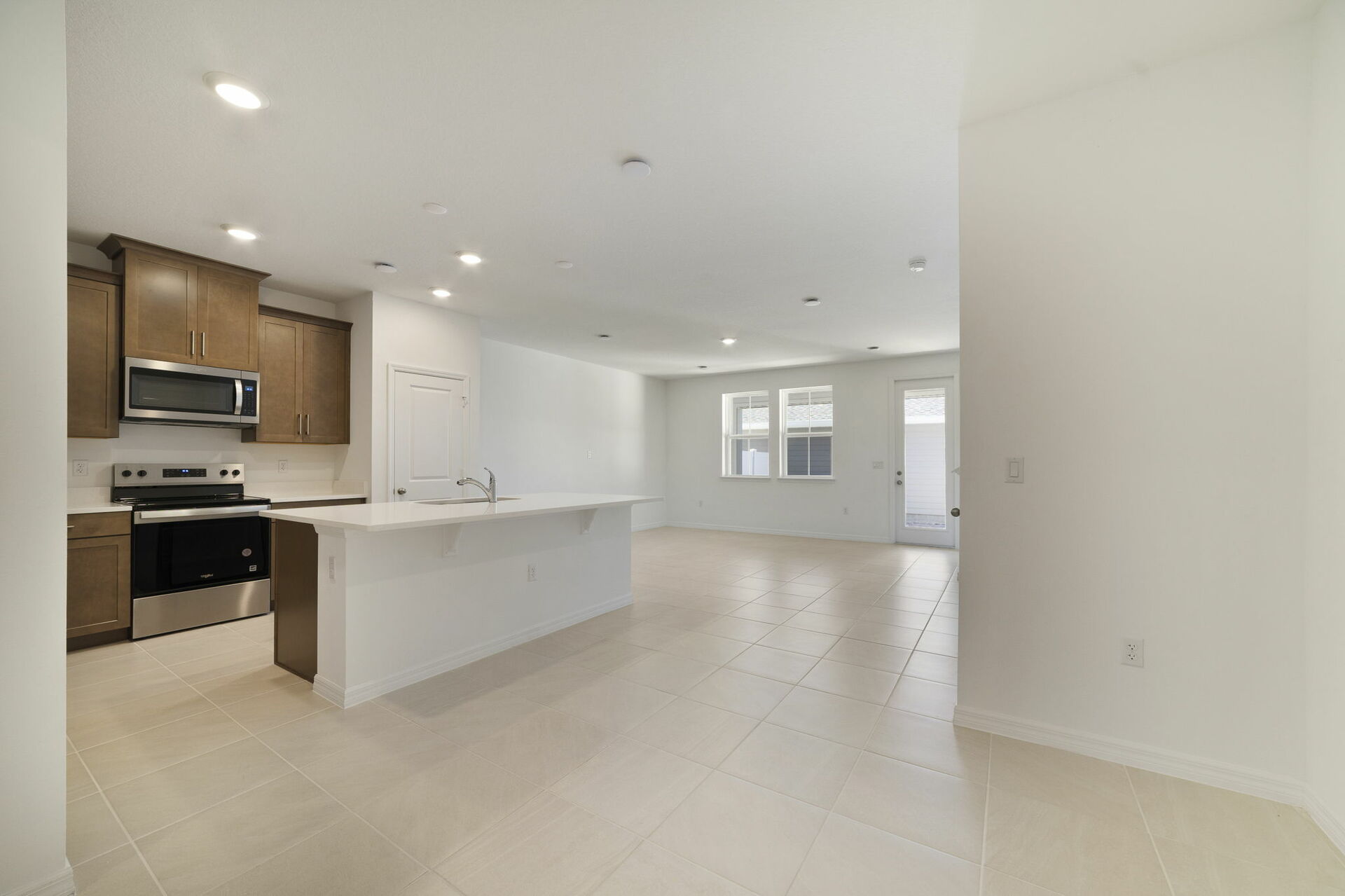 kitchen with island and view of great room and dining room