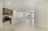 kitchen with island and view of great room and dining room