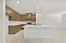 kitchen with island and view of great room and dining room