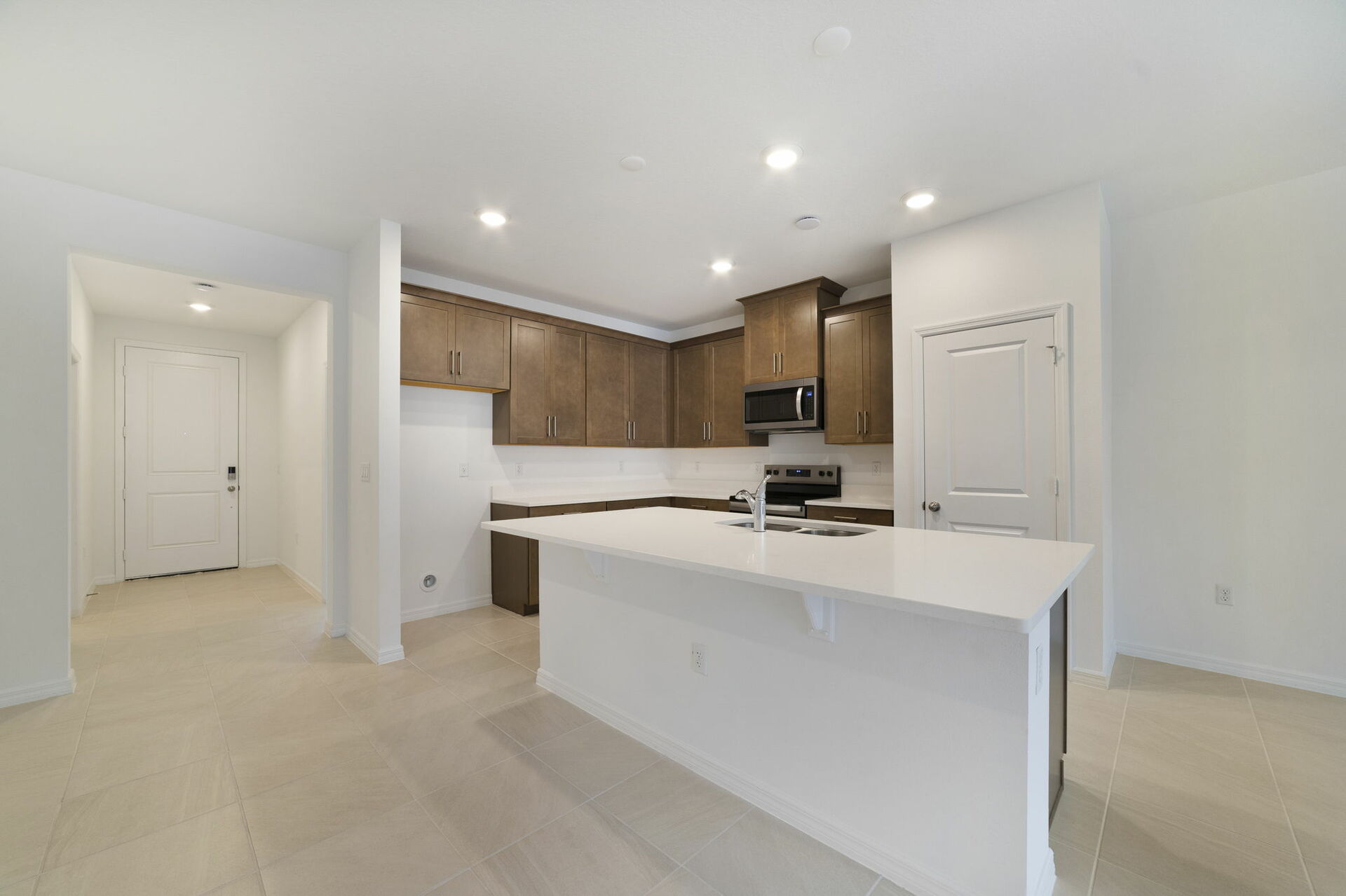 kitchen with island and view of great room and dining room