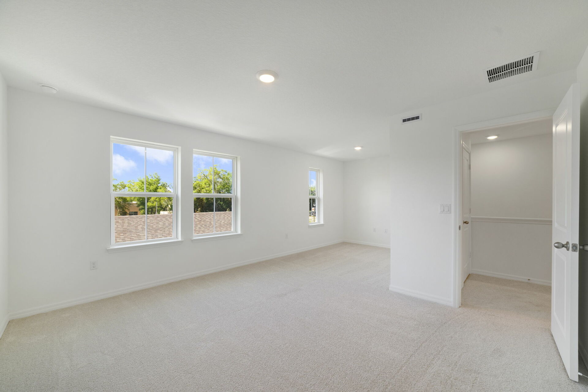 room with carpet throughout and view of sitting room