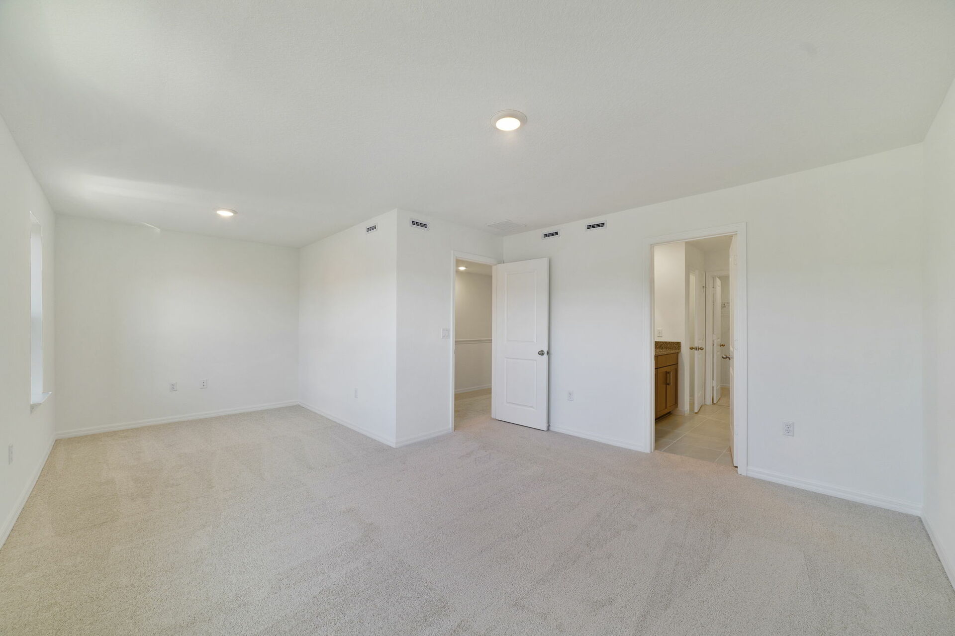 room with carpet throughout and view of sitting room