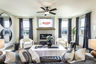 great room with shiplap fireplace and windows
