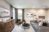 loft with plank flooring and gray couch 