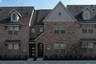 exterior of home with brown brick and covered front porch