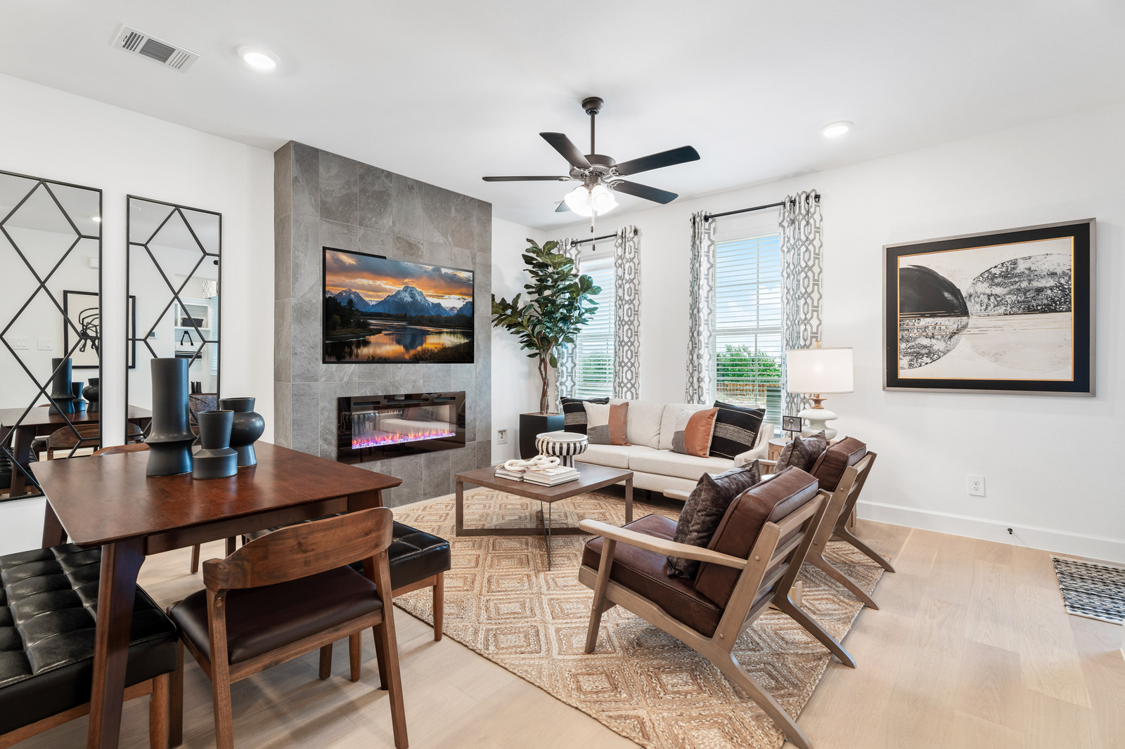 great room with large windows and hardwood floors