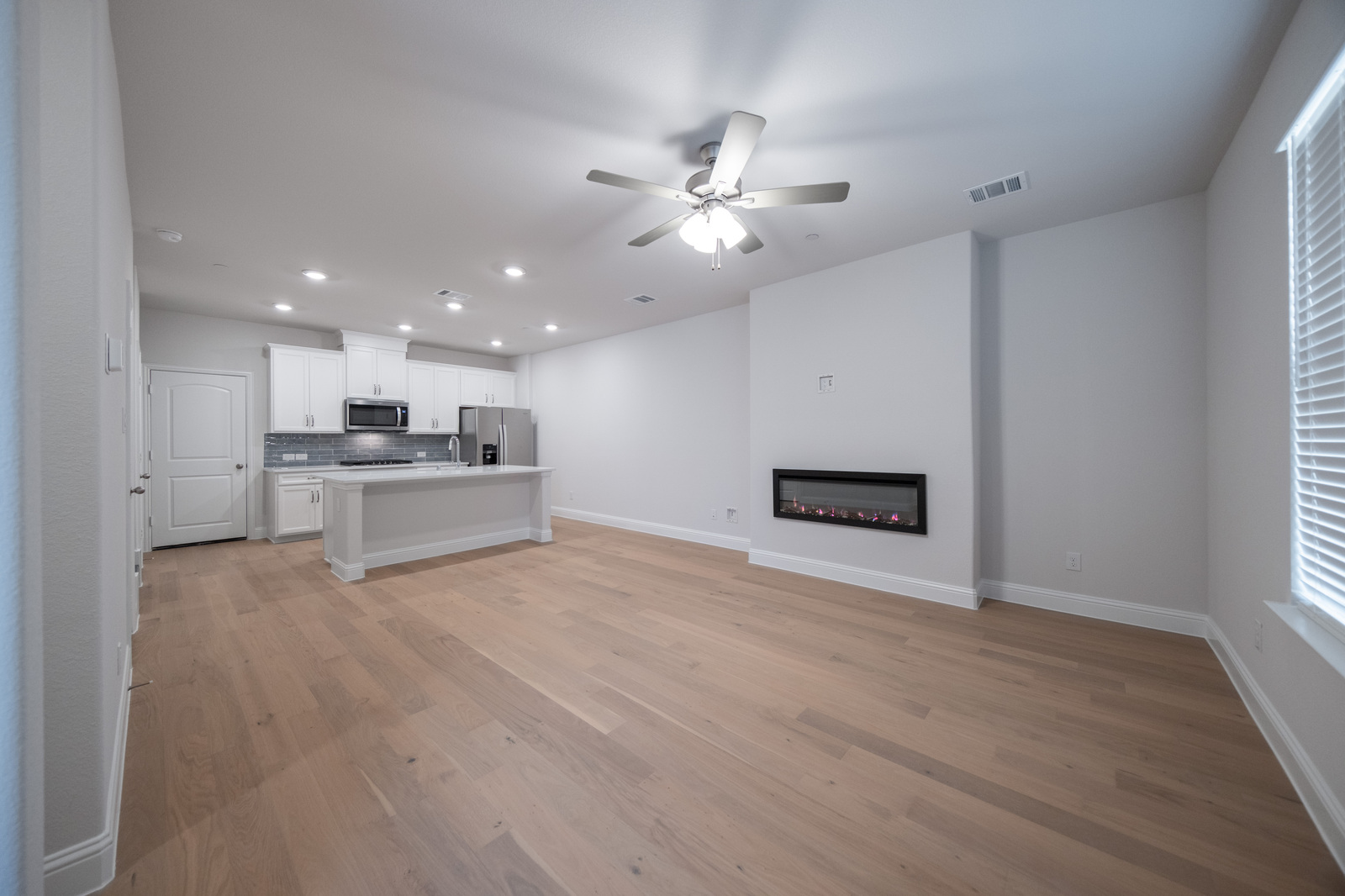 spacious great room with electric fireplace