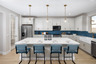 kitchen with white cabinets, quartz countertops, and teal barstools