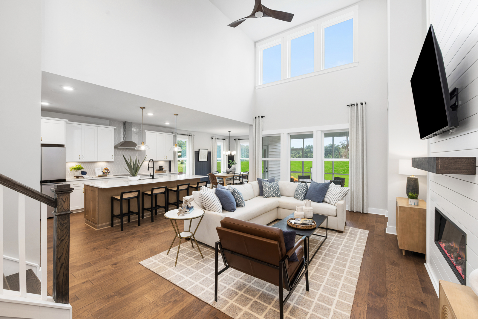 spacious great room with a two-story ceiling