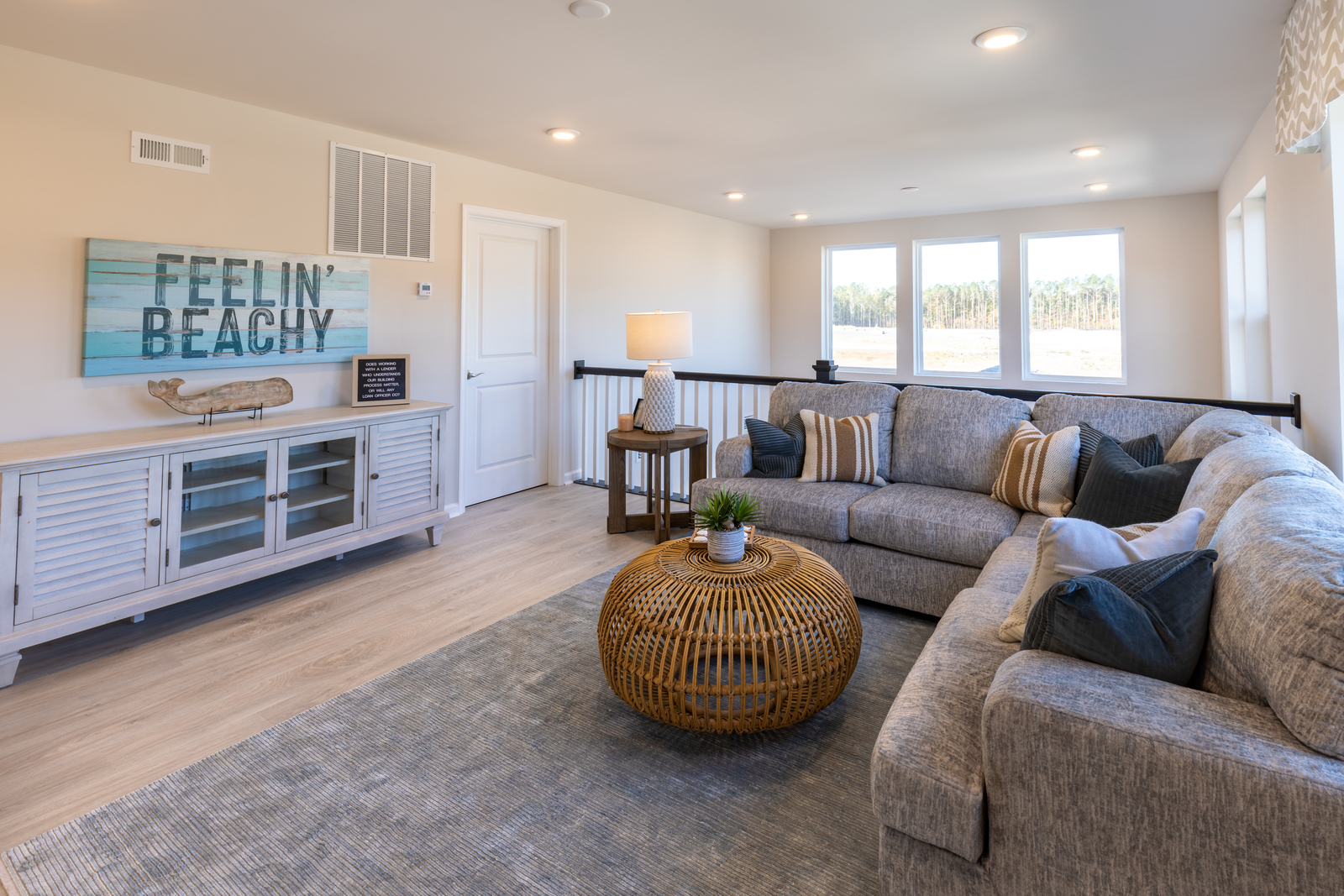 2nd-floor loft with a sectional couch