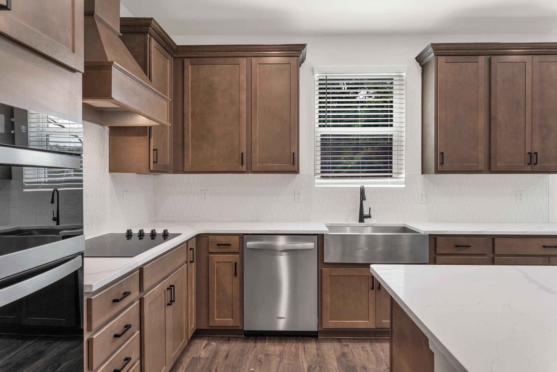 kitchen with dark wood cabinets and tile backsplash