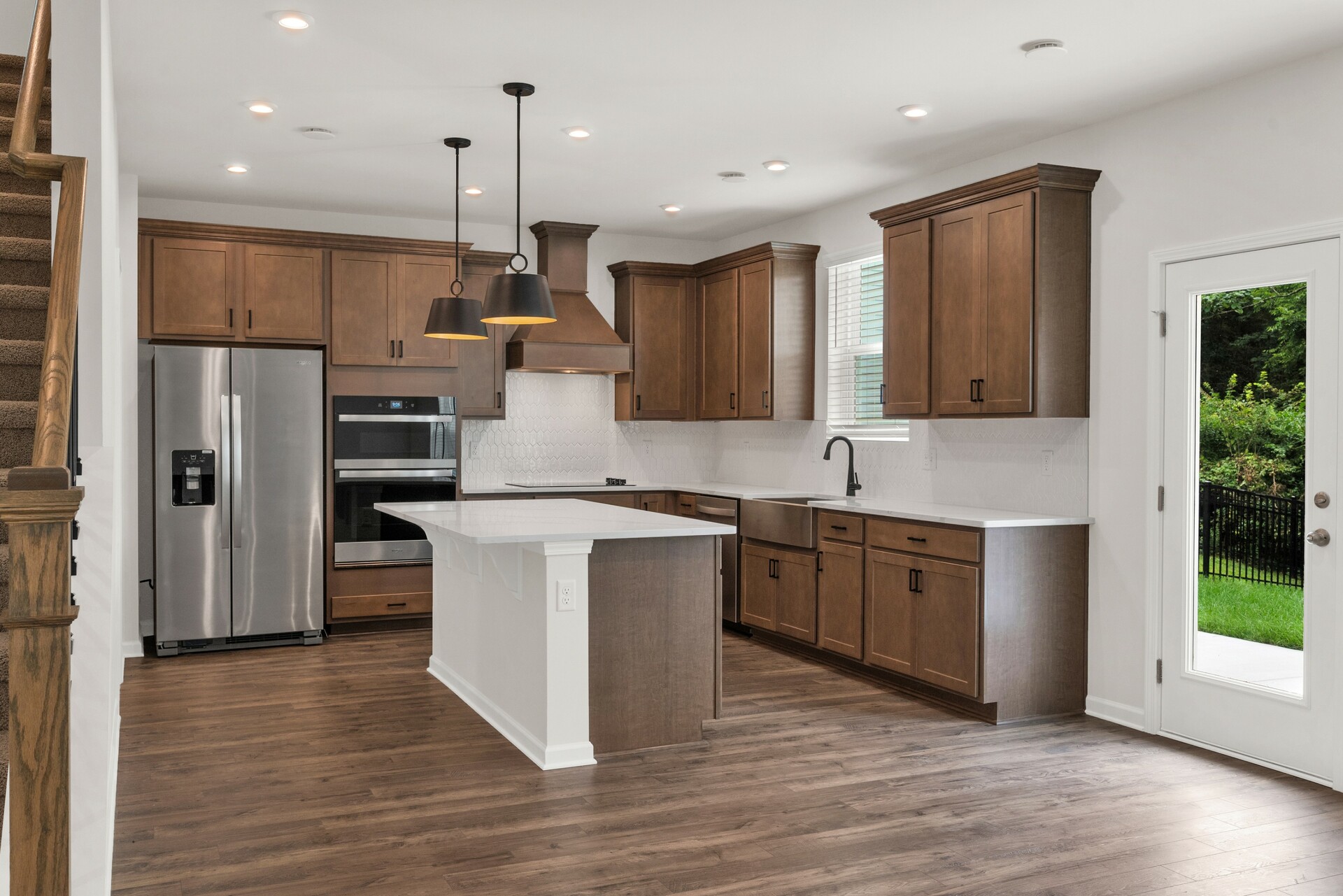 kitchen with large island and dark wood cabinets
