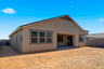 spacious backyard with covered patio for entertaining and relaxing
