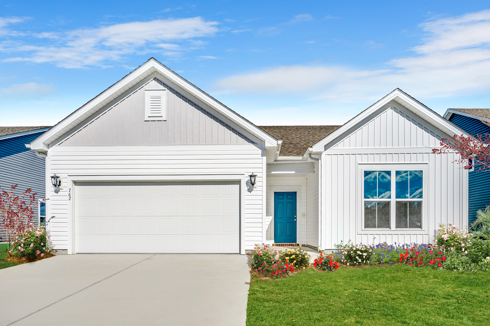white vinyl siding with blue front door