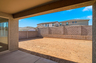 spacious covered patio with recessed lighting and views of a dirt backyard ready for landscaping