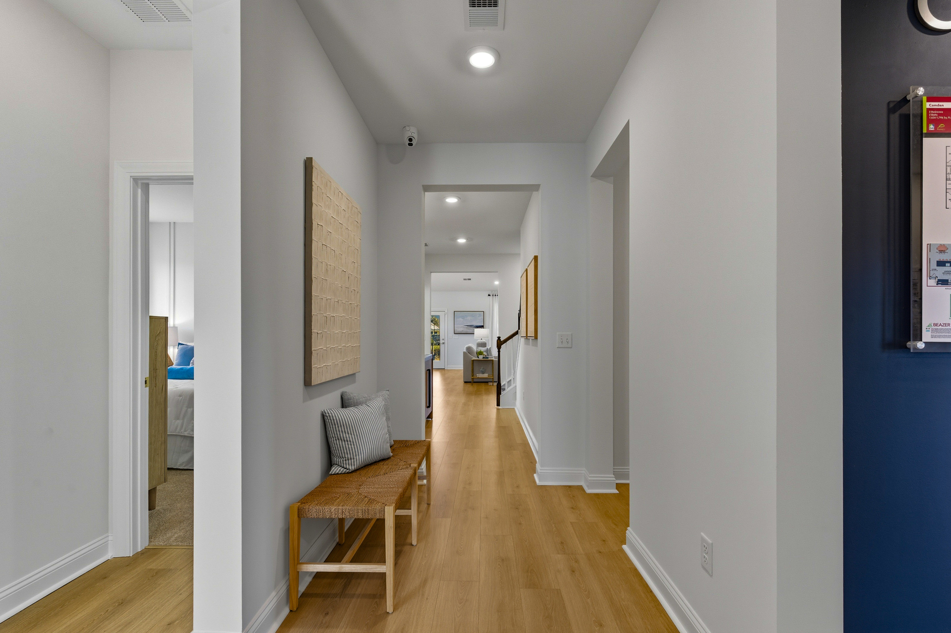 long entryway with hardwood floors 