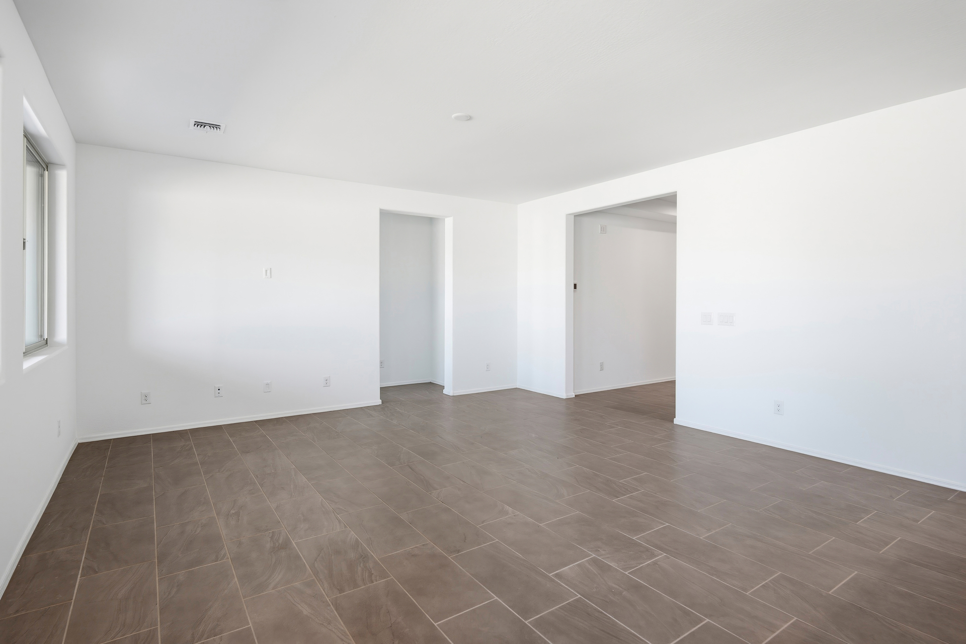 open-concept space with tile flooring and recessed lights