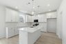 kitchen with white walls, white cabinets, and stainless steel appliances