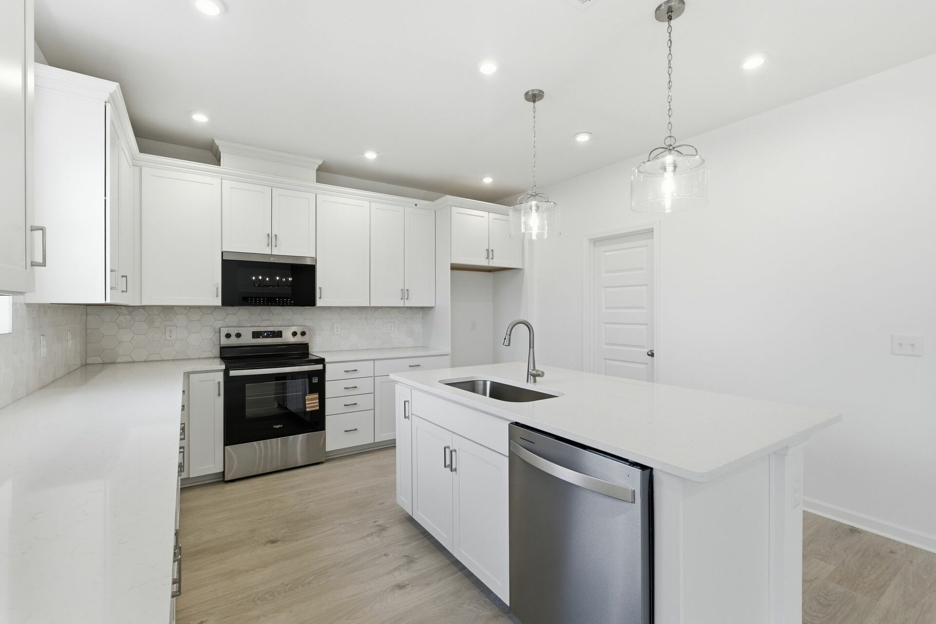 kitchen with white walls, white cabinets, and stainless steel appliances