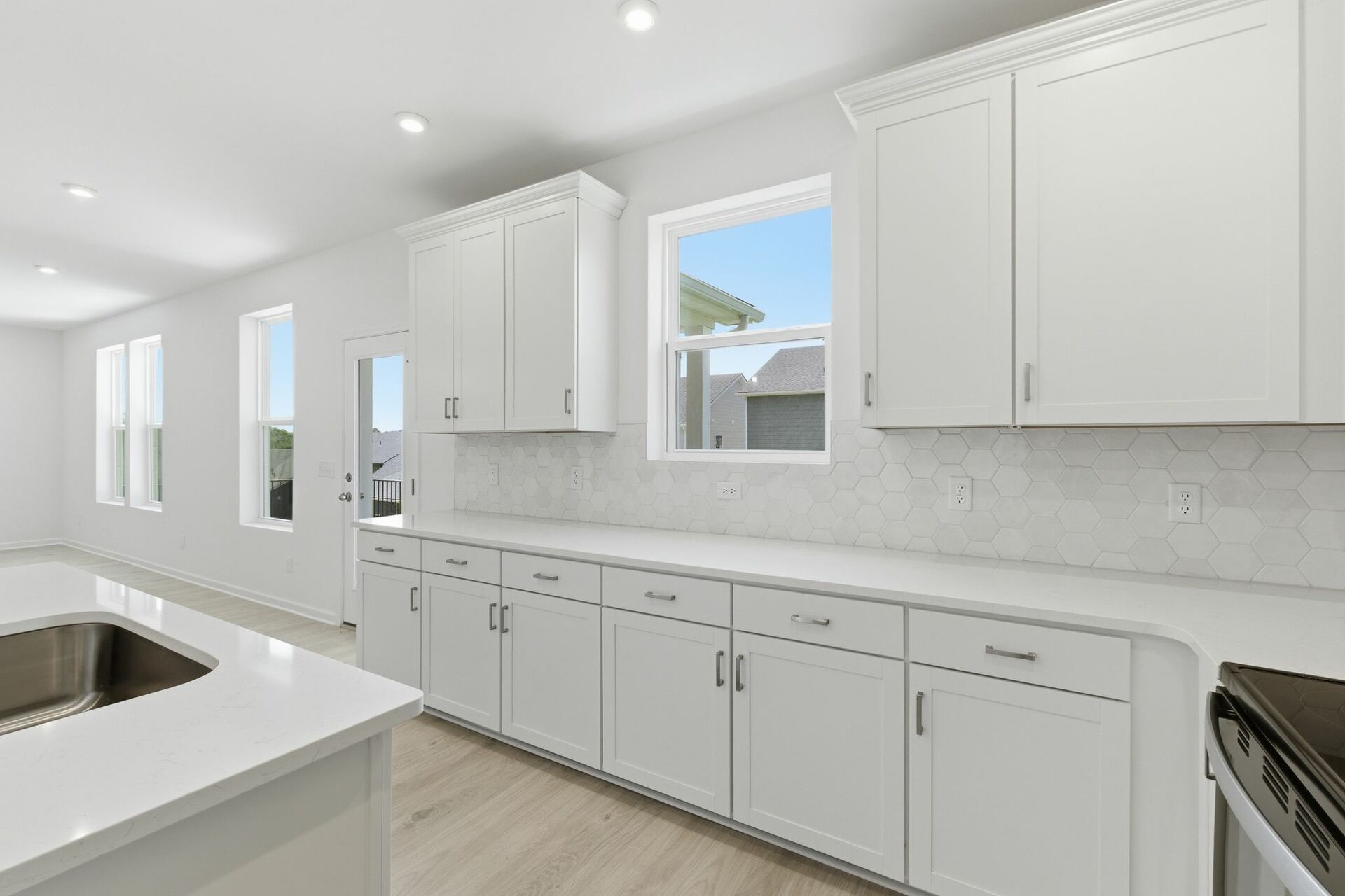 kitchen with white walls, white cabinets, and stainless steel appliances
