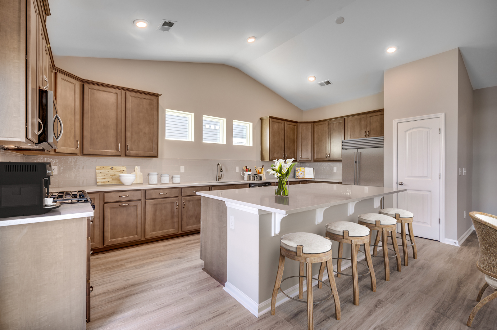 spacious kitchen with brown cabinets 