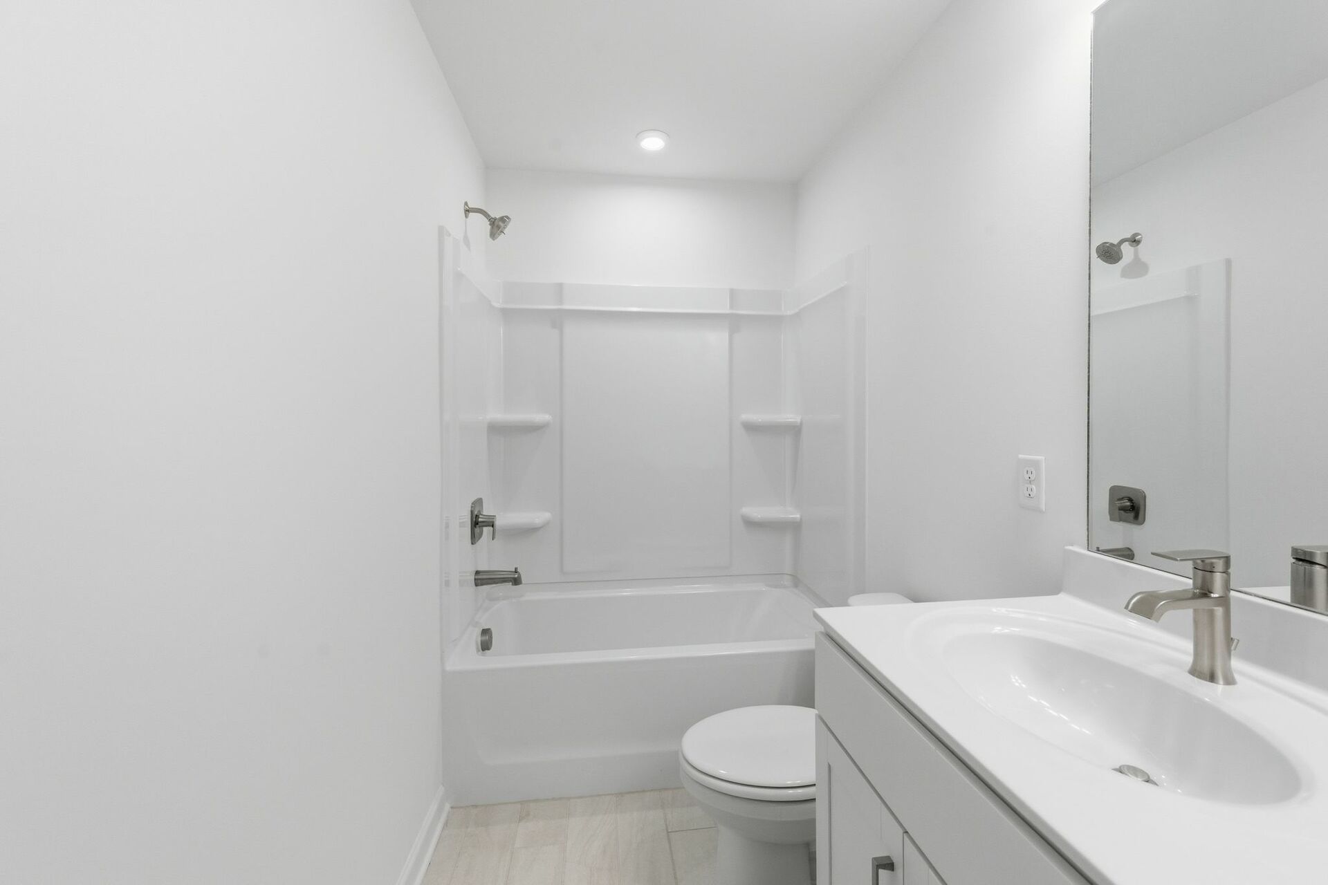 secondary bathroom with white cabinets, tile flooring, and a shower and tub combination